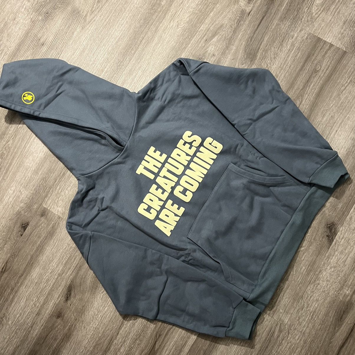 image of Creature World X Advisry The Creatures Are Coming Hoodie in Blue, Men's (Size Medium)