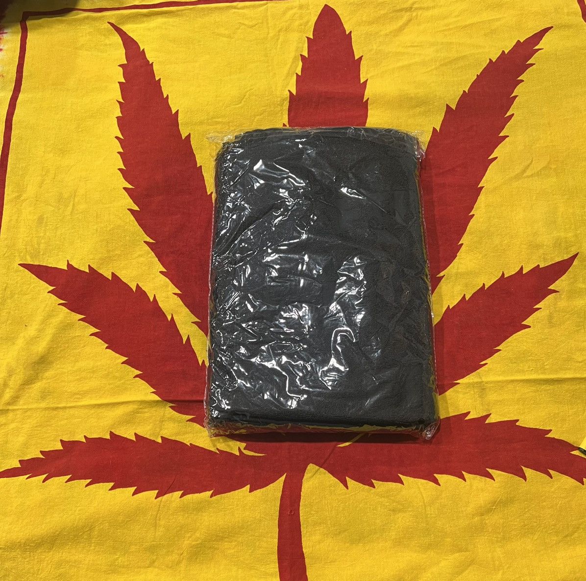 FUCK THE POPULATION ALLOVER DEBOSSED LOGO BEACH TOWEL BLACK