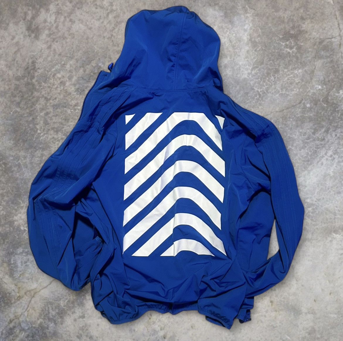 Adidas Originals blue windbreaker jacket.