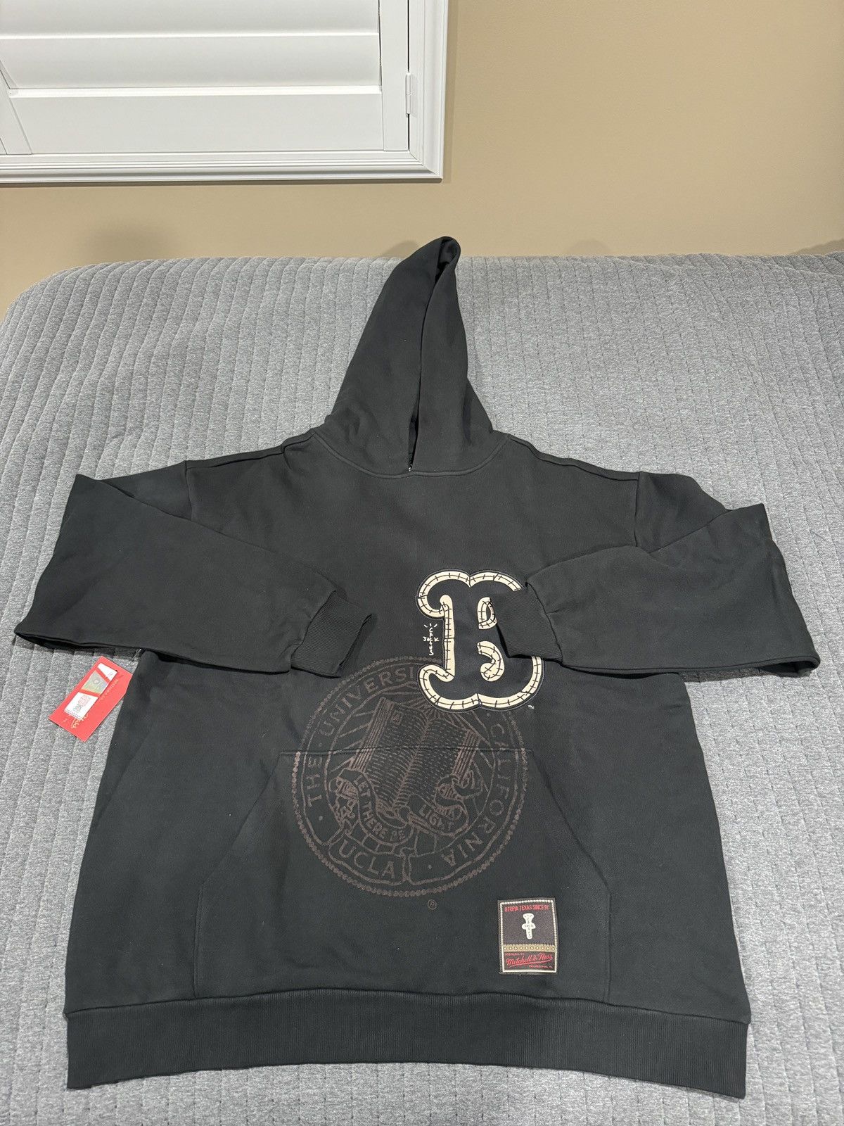 image of Mitchell Ness x Travis Scott - Mitchell & Ness - Ucla Bruins Hoodie in Black, Men's (Size 2XL)