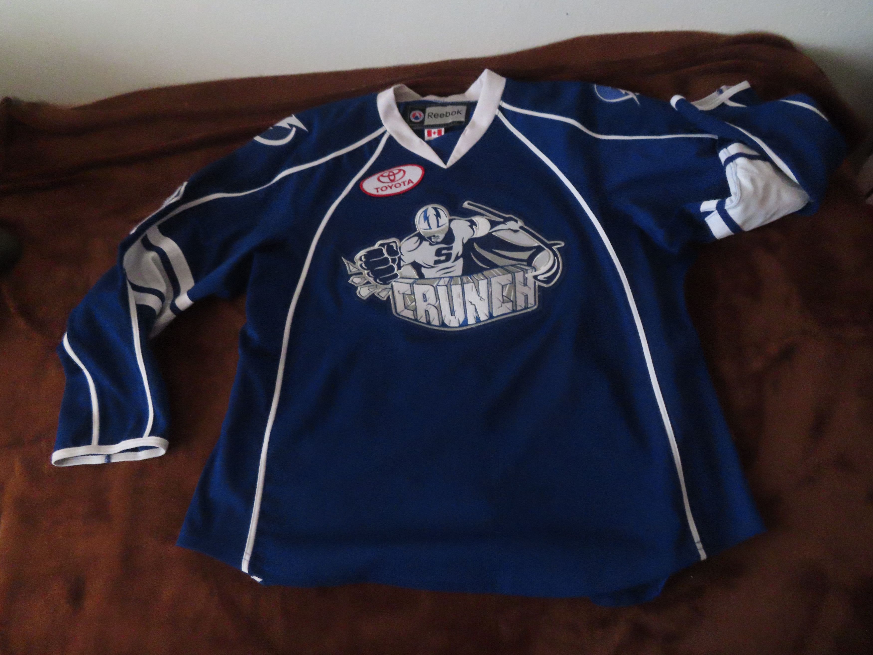 Image of Syracuse Crunch Ahl Hockey Jersey Tampa Bay Lightning in Blue, Men's (Size XL)