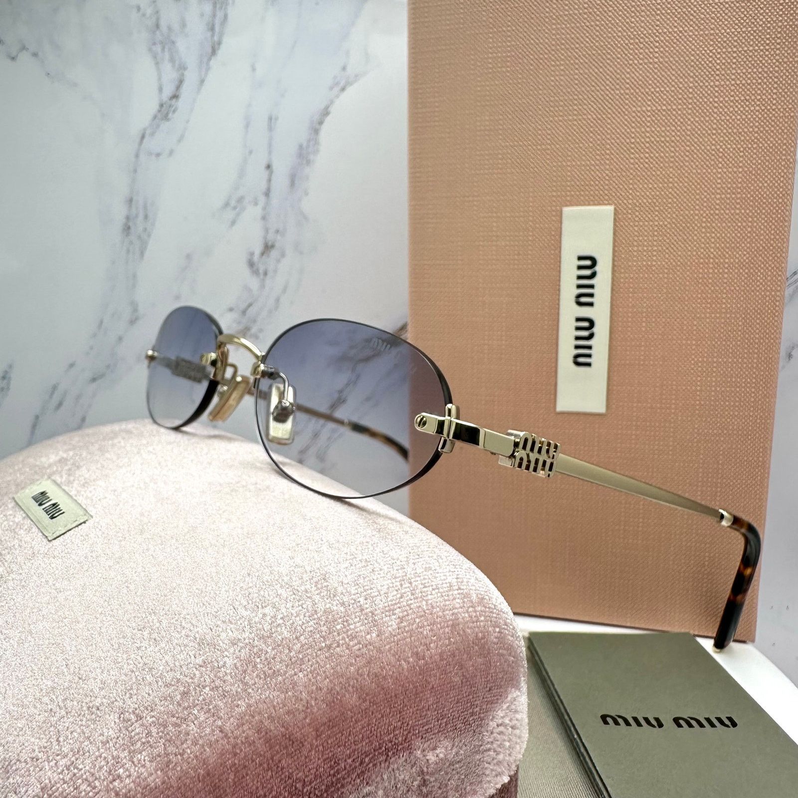 New MIU MIU Sunglasses Oval MU A54S Gold Rimless Gradient