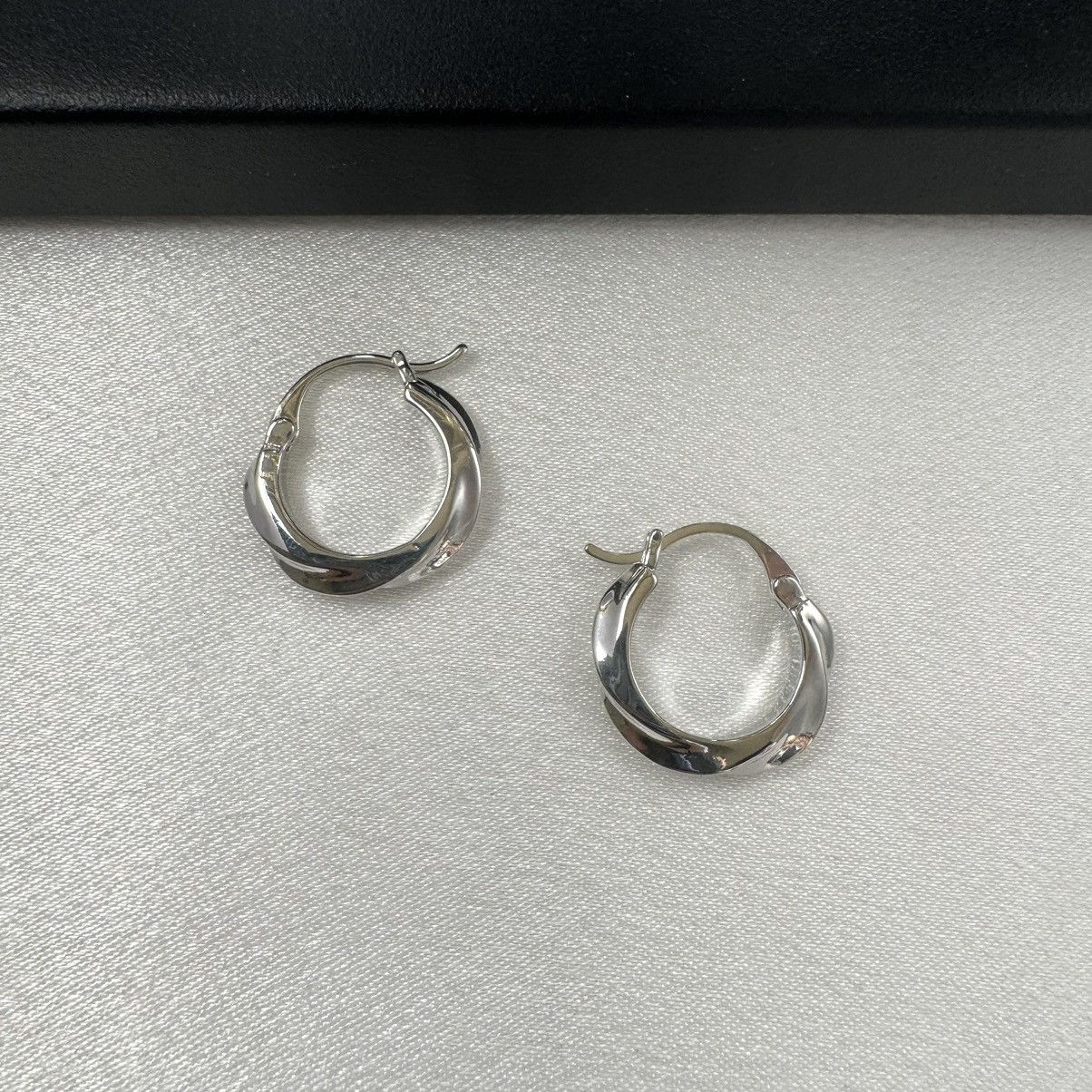 Designer Twisted Silver Hoop Earrings for Women Size ONE SIZE - 3 Thumbnail