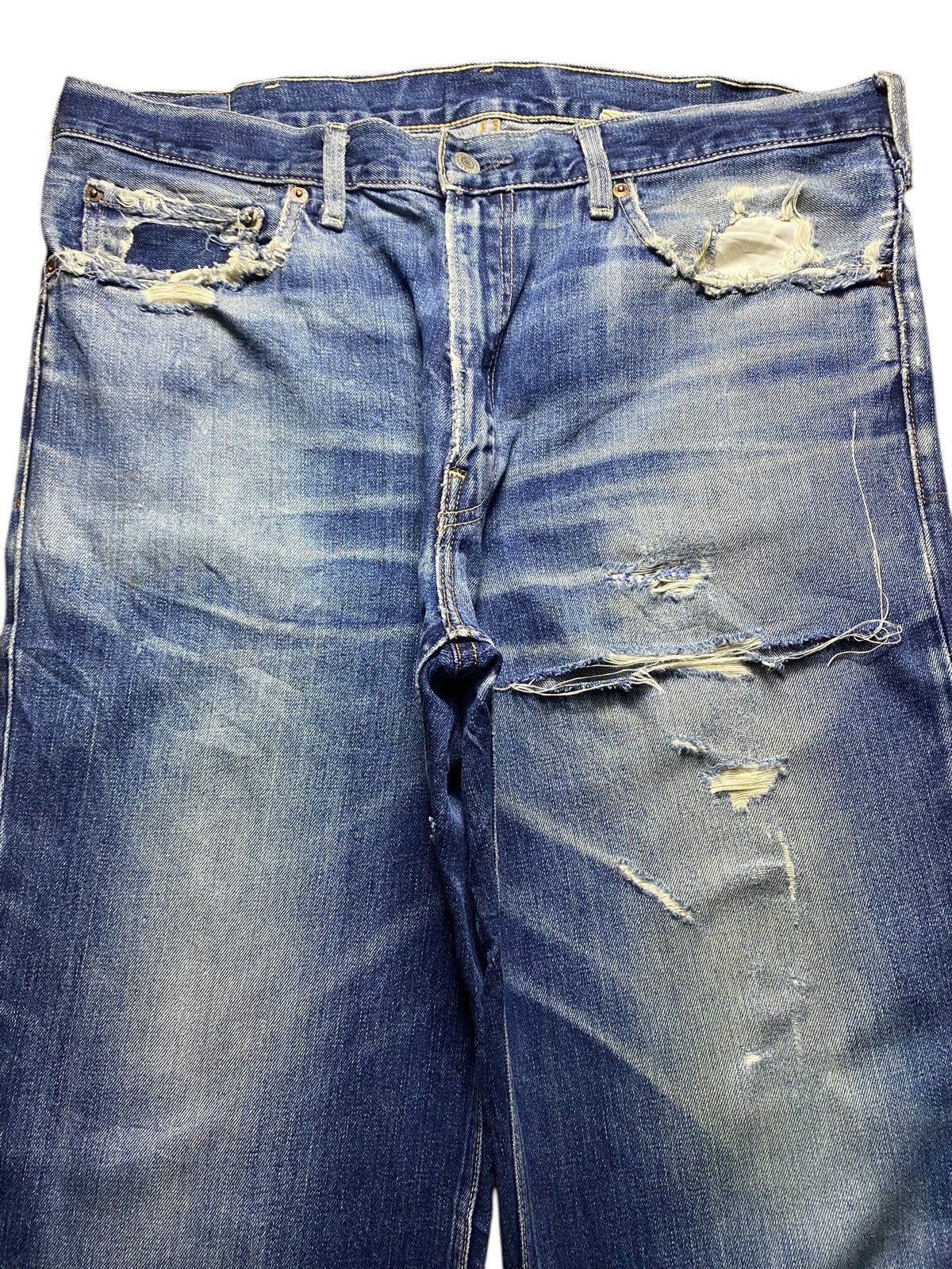 Vintage Levis 502 Blue Wash Ripped Straight Jeans