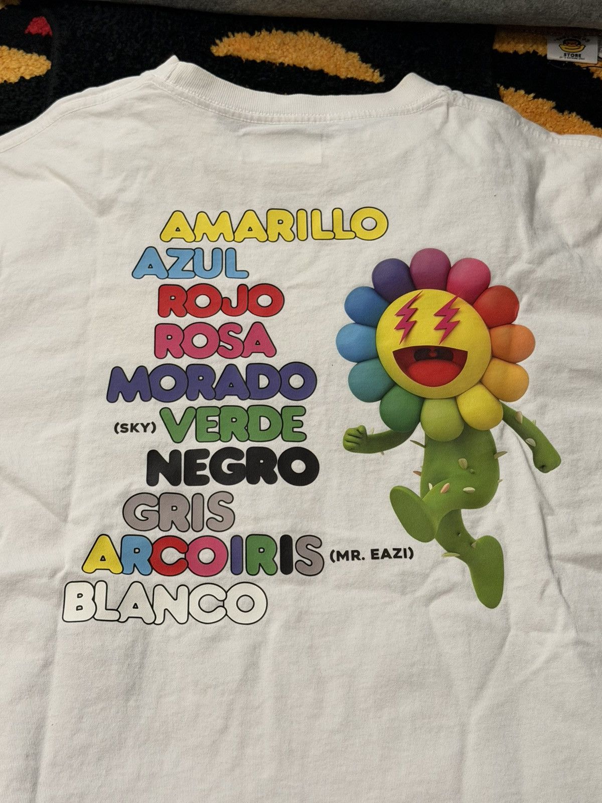 Takashi Murakami Takashi Murakami-J Balvin Tee. White used worn once. Colores Size US L / EU 52-54 / 3 - 1 Thumbnail