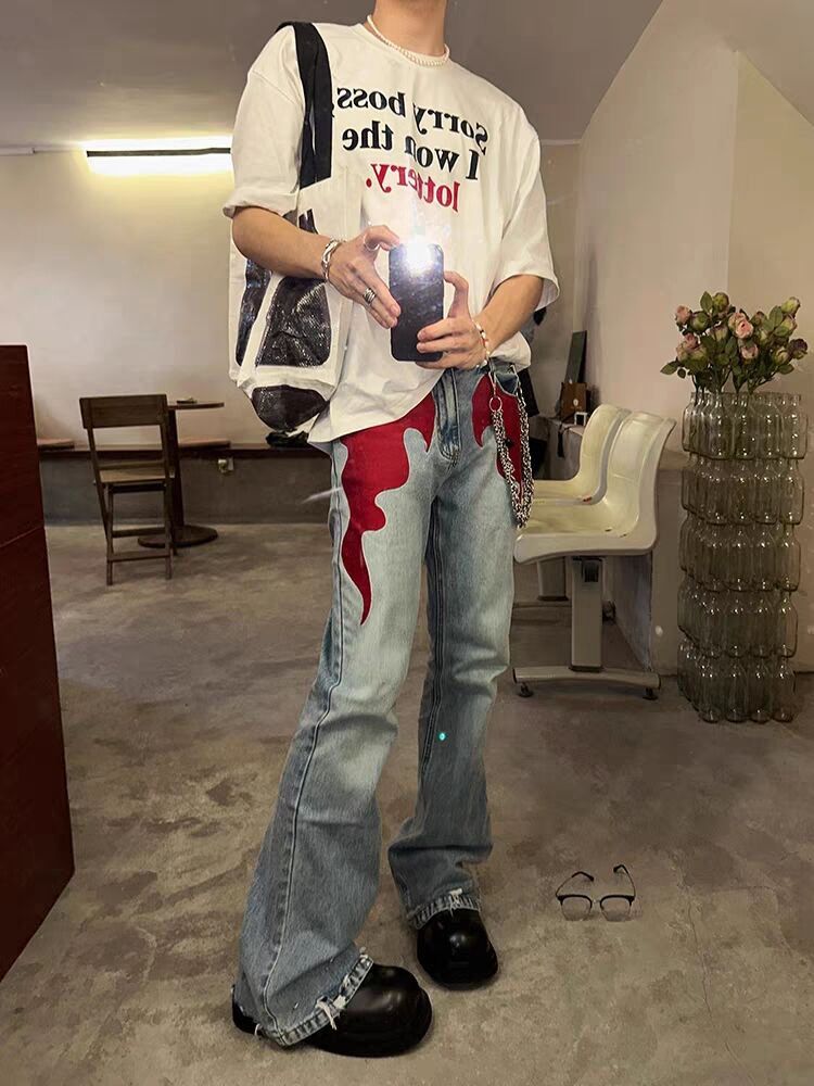 Retro washed distressed flame print jeans