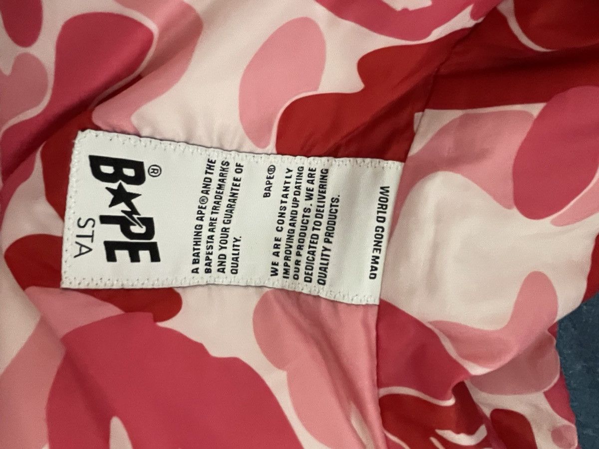 A bathing ape (bape) pink puffer jacket
