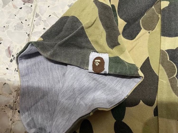 Bape × Kaws BAPE x KAWS REVERSIBLE 1st CAMO Size US L / EU 52-54 / 3 - 6 Thumbnail
