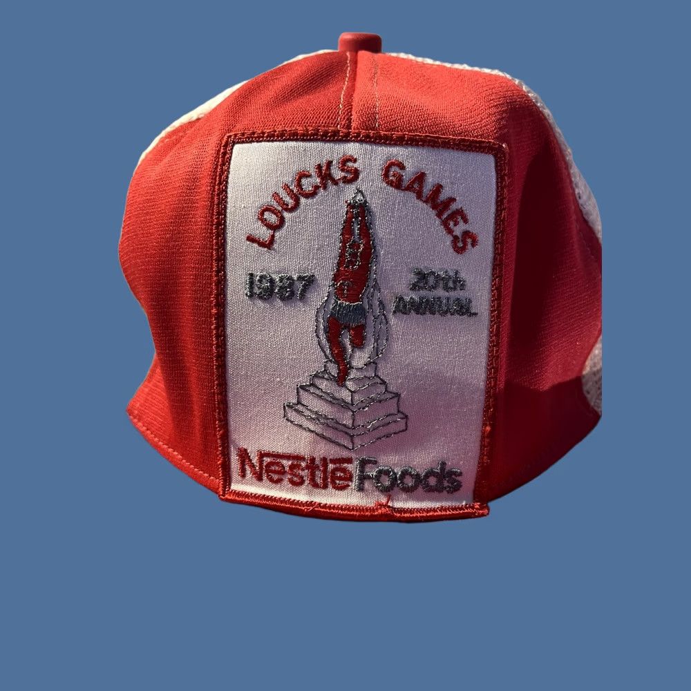 Vintage VINTAGE Nestle Loucks Games 1987 Trucker Hat Men’s Red 80s Baseball Adjustable Snapback Hat Size ONE SIZE - 1 Thumbnail