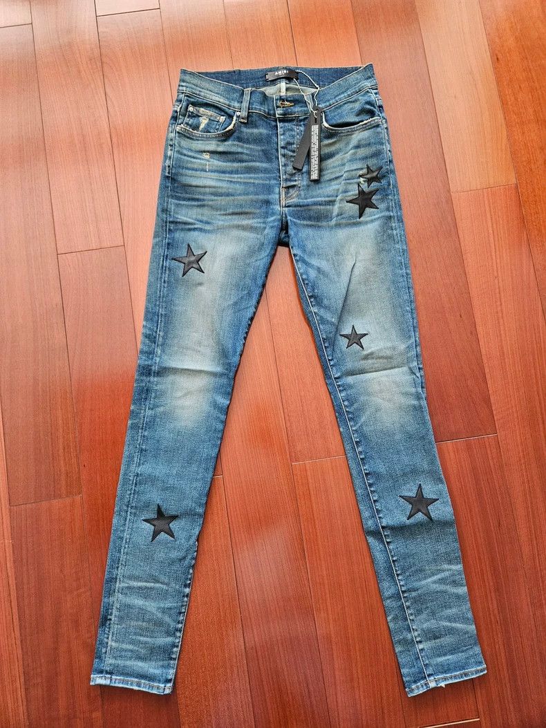 Amiri star patched art denim jeans