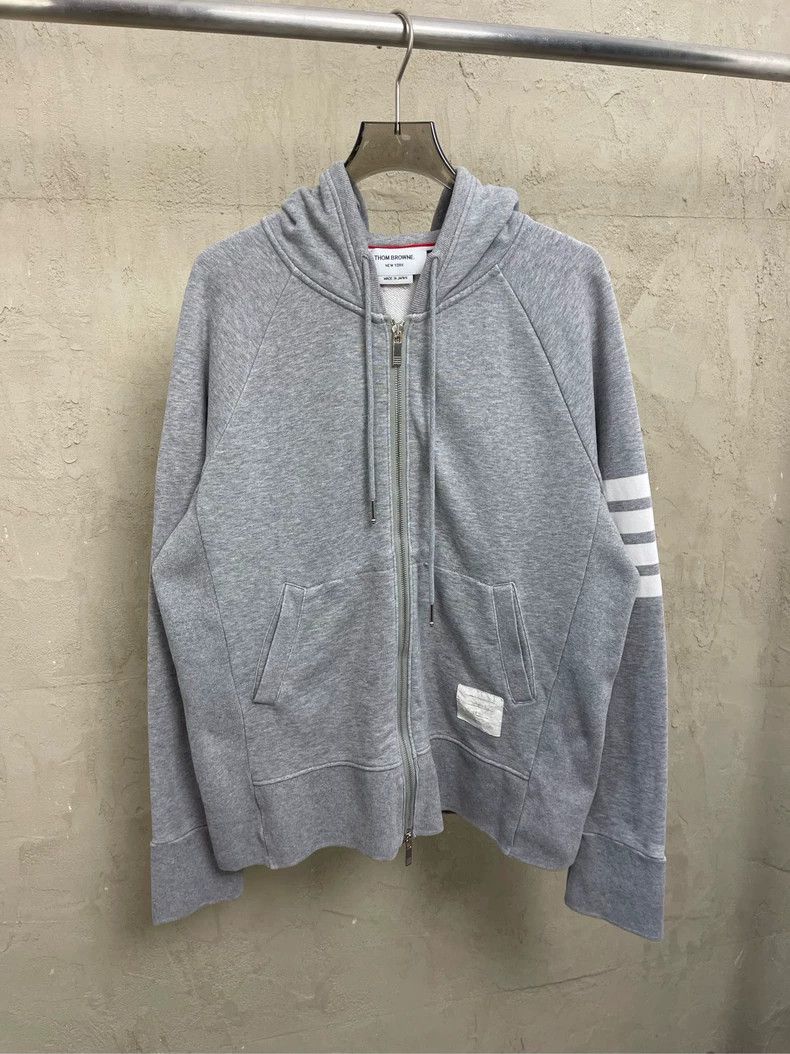 Thom Browne A trench coat with a hood