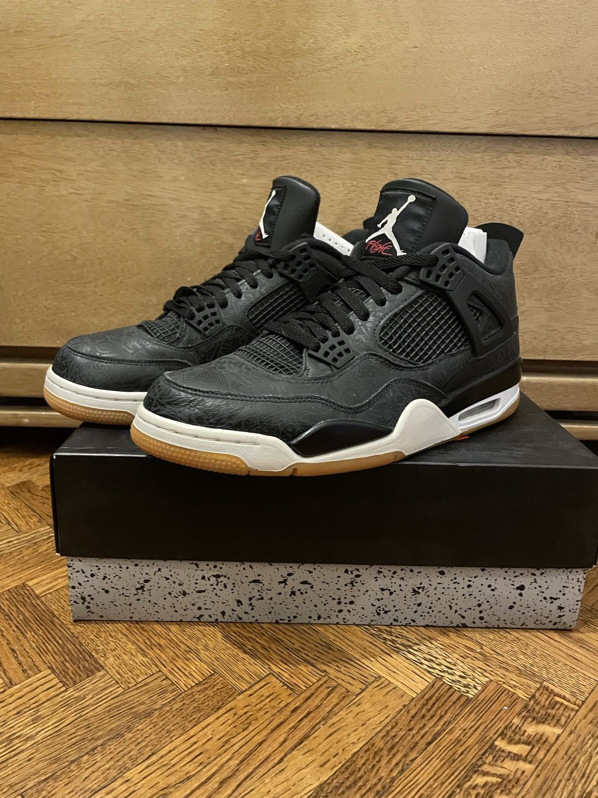 tan and black jordan 4