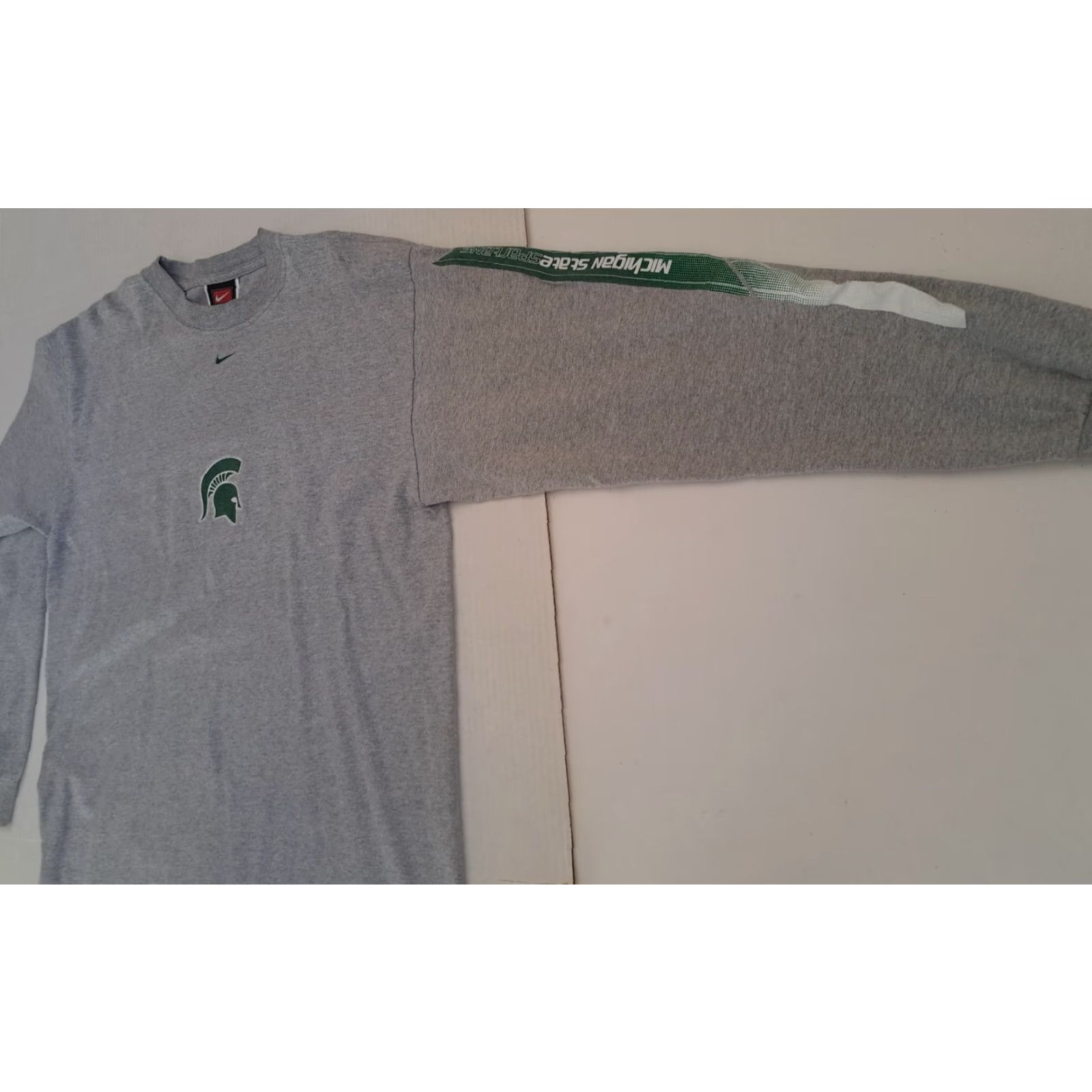 Nike **90s Michigan State U. Printed Nike Gray Crew Neck T-Shirt Med** User: VINTAGE Michigan State U. Printed Nike Gray Crew Neck T-Shirt Med 90s **M** Size US M / EU 48-50 / 2 - 3 Thumbnail