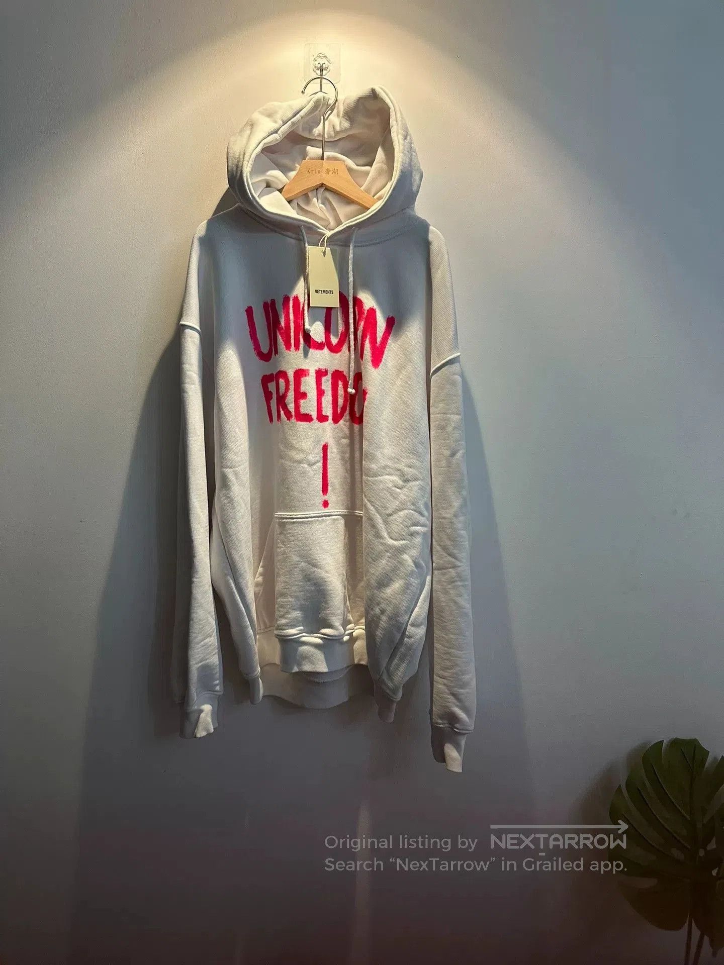 vetements unicorn sweatshirt with pink lettering.