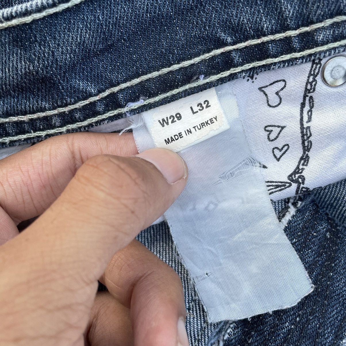 VINTAGE Y2K EVISU X PUMA DISTRESSED WASHED DENIM PANTS