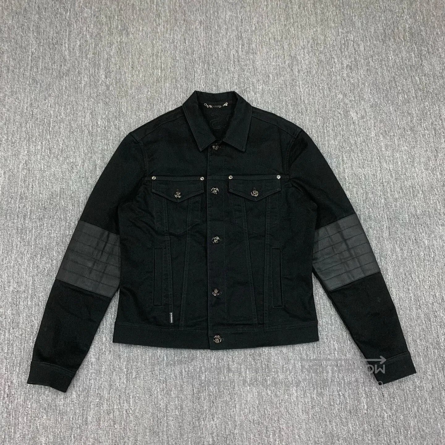 black short denim jacket with logo.