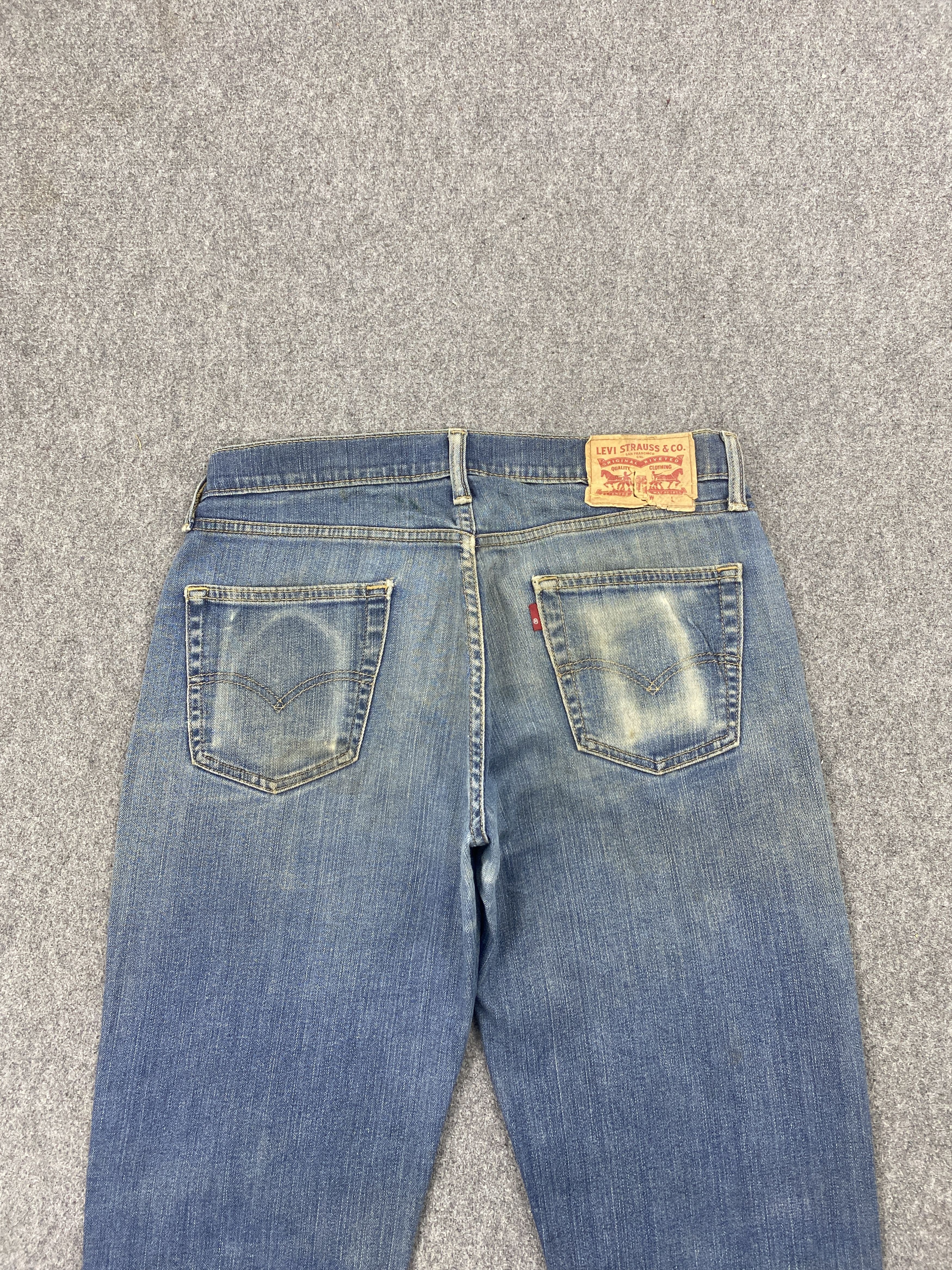 Distressed Vintage Levi's 514 Faded Blue Jeans