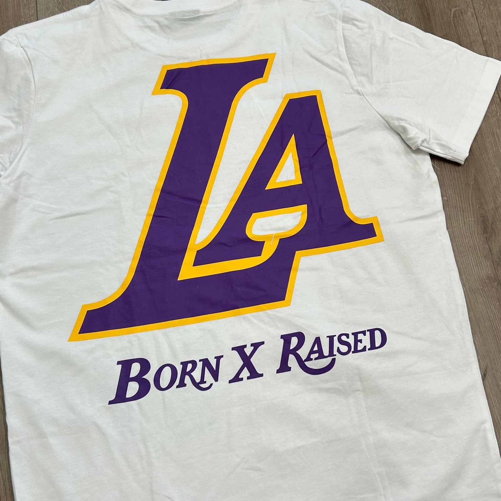 New Era New Era Born x Raised Los Angeles Lakers Tee T Shirt size L Size US L / EU 52-54 / 3 - 6 Thumbnail