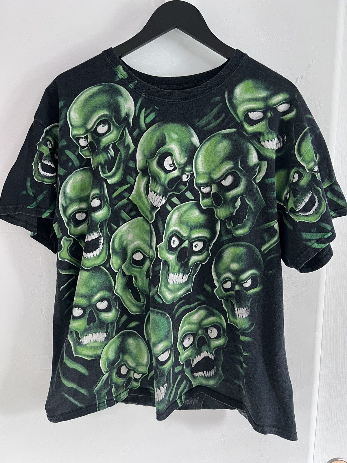 Liquid Blue Green Skulls Pile tee