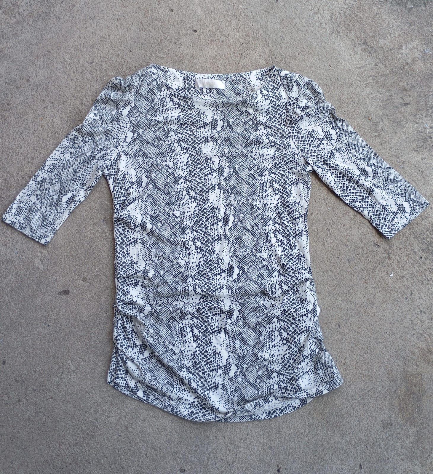 women top with snakeskin motif