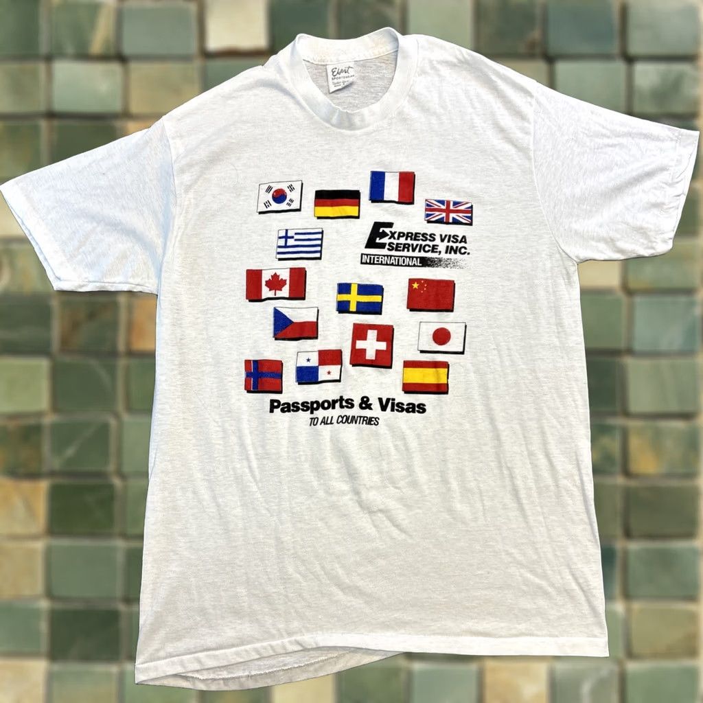 Vintage VINTAGE Ebert Sportswearvisas And Passports T Shirt Men’s XL White Graphic Trace Mens XL White T Shirt Size US XL / EU 56 / 4 - 1 Thumbnail