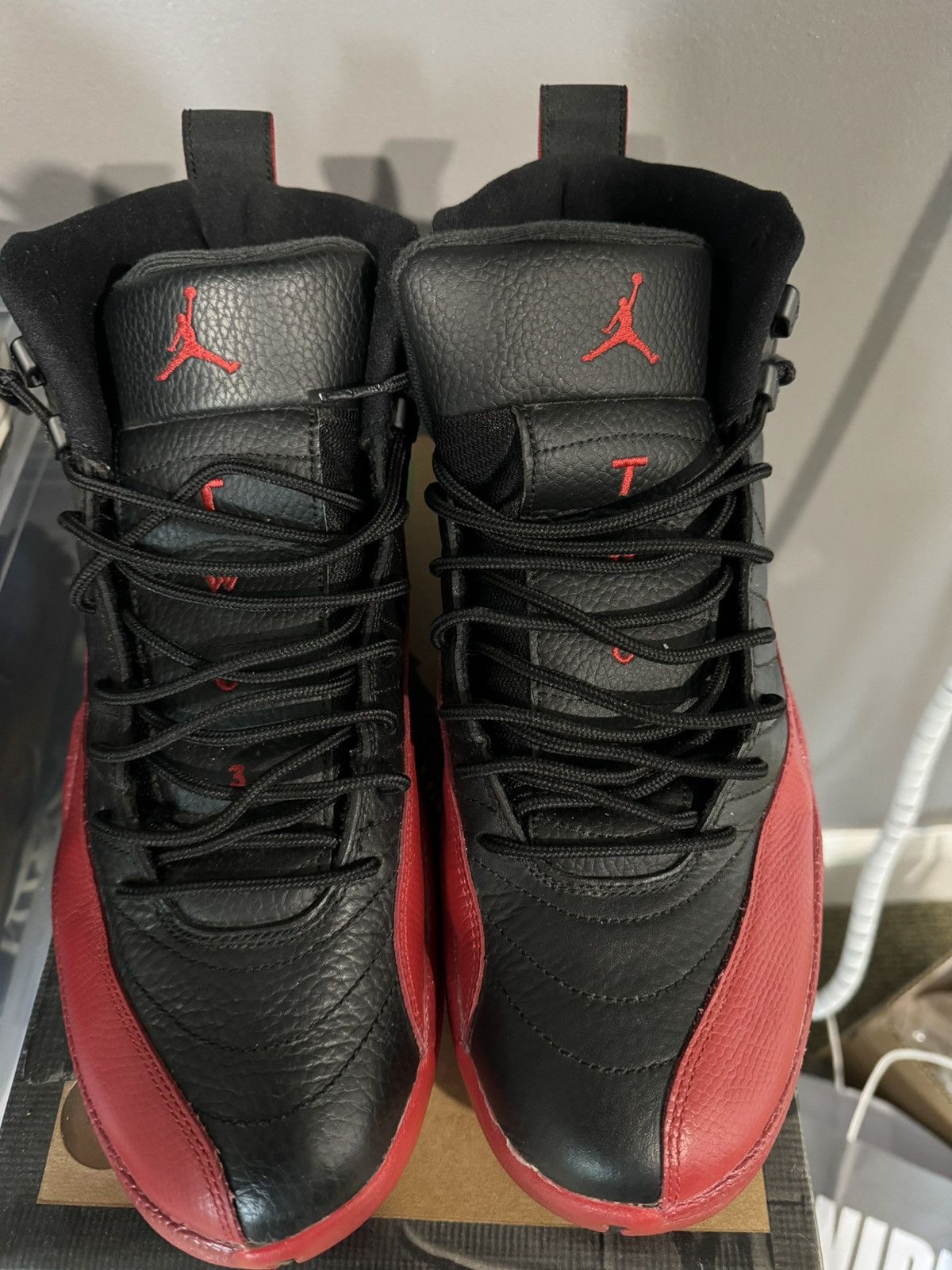 image of Jordan Brand 12 Flu Game Shoes in Black, Men's