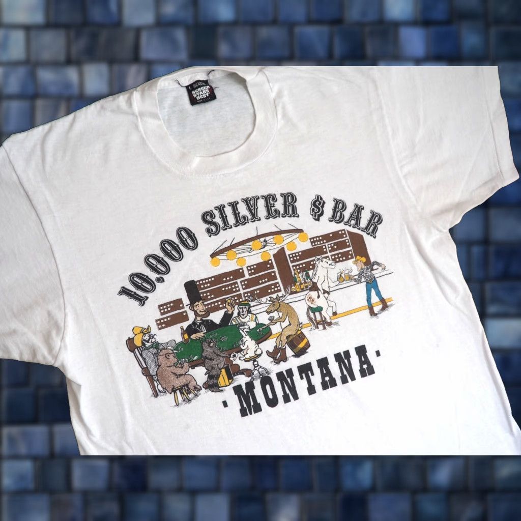 Vintage VTG 80s 90s Screen Stars Montana 10000 Silver Dollar Bar Art White Tee T-Shirt L Men Short Sleeve Cotton Blend Graphic Tee Size US L / EU 52-54 / 3 - 1 Thumbnail