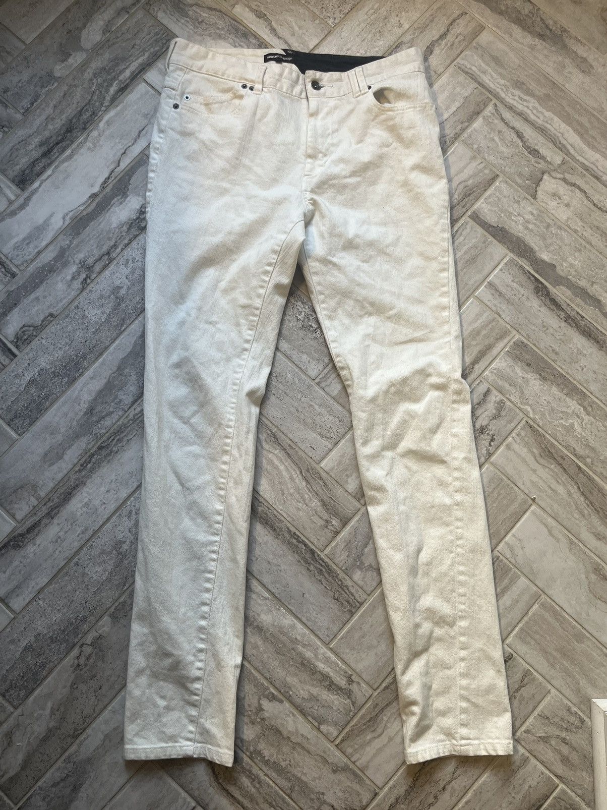 white semantic design jeans