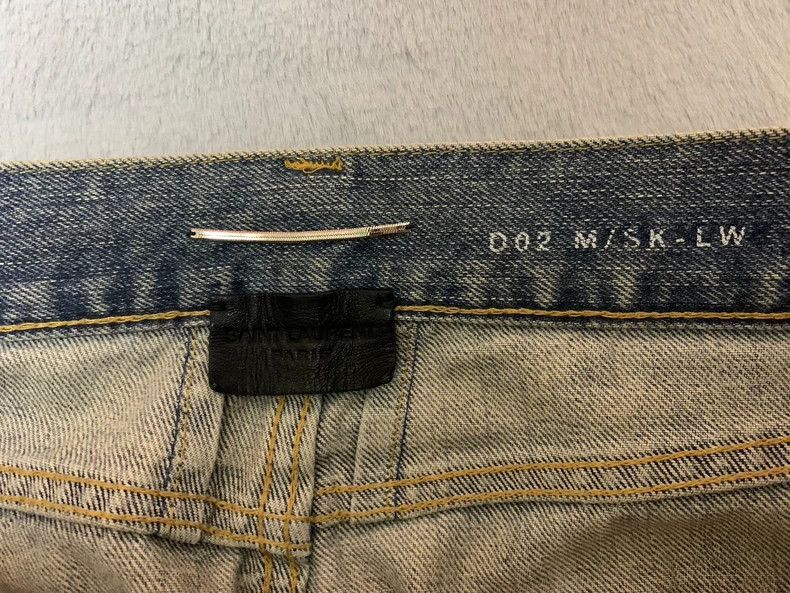 saint Laurent blue distressed denim pants