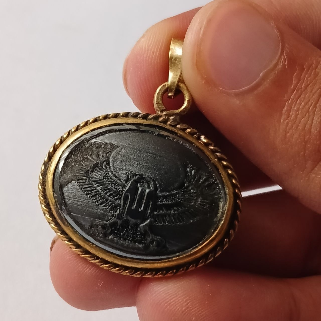 Vintage brass pendant with engraved eagle design