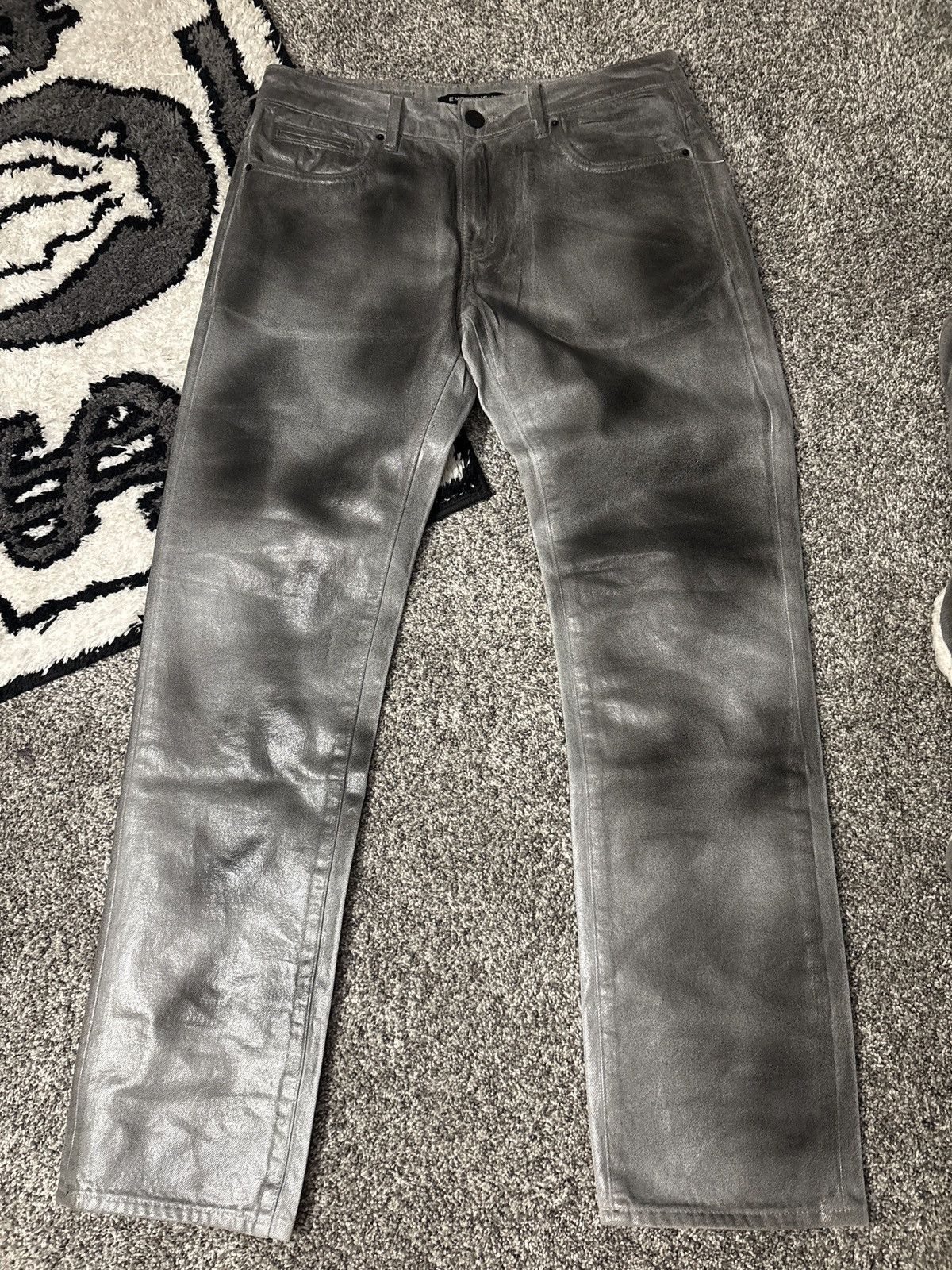 Gray and black waxed jeans