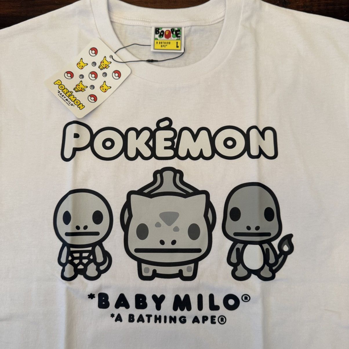 Bape × Pokemon BAPE Baby Milo x Pokemon Monotone Starters Tee #3 Size US L / EU 52-54 / 3 - 5 Thumbnail