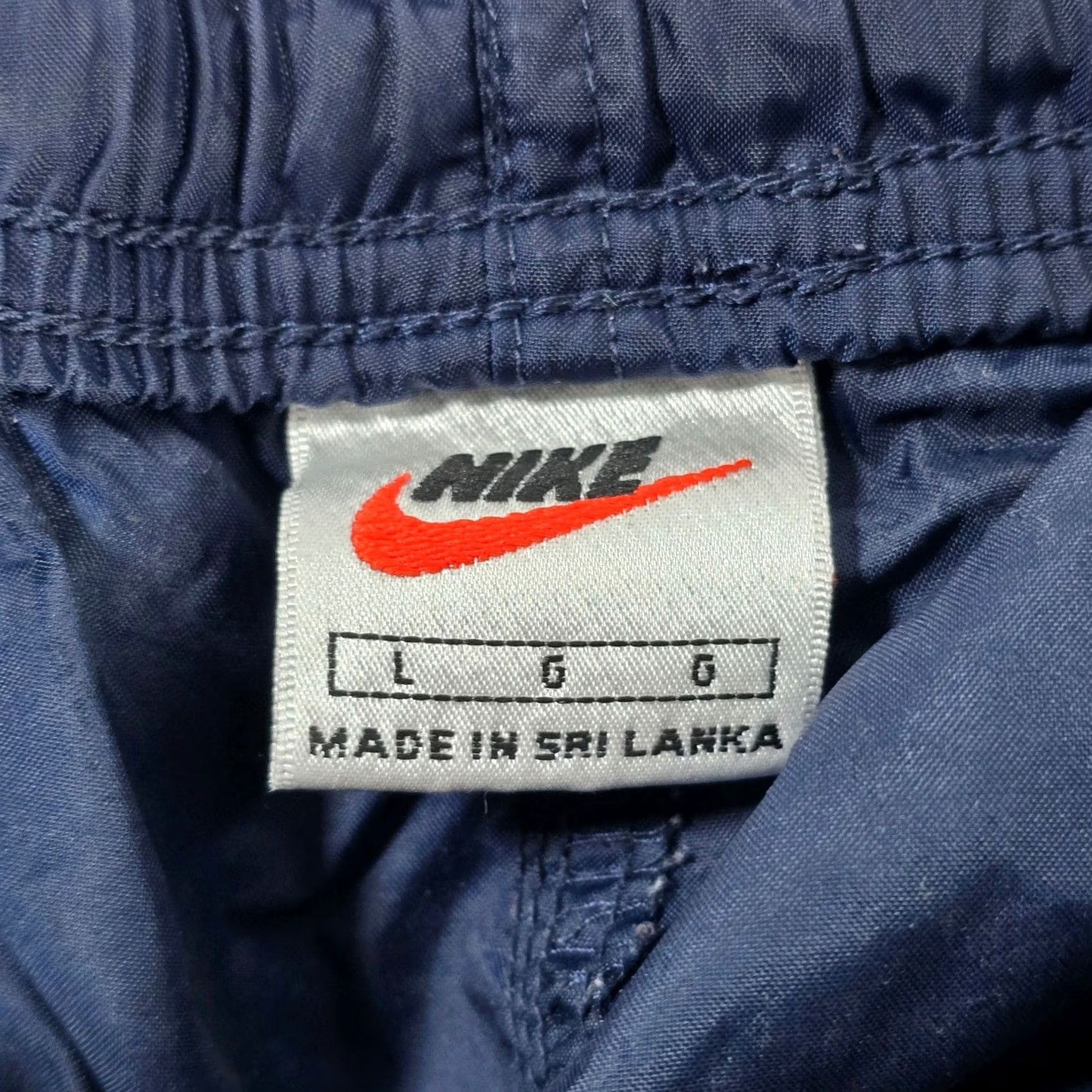 Nike VTG Nike Mens Navy Blue Nylon Track Pants Athletic Joggers L Elastic Waist Drawstring Pockets Zippered Legs Casual Activewear 90s Womens/Mens (Unisex) Size US 33 - 7 Thumbnail
