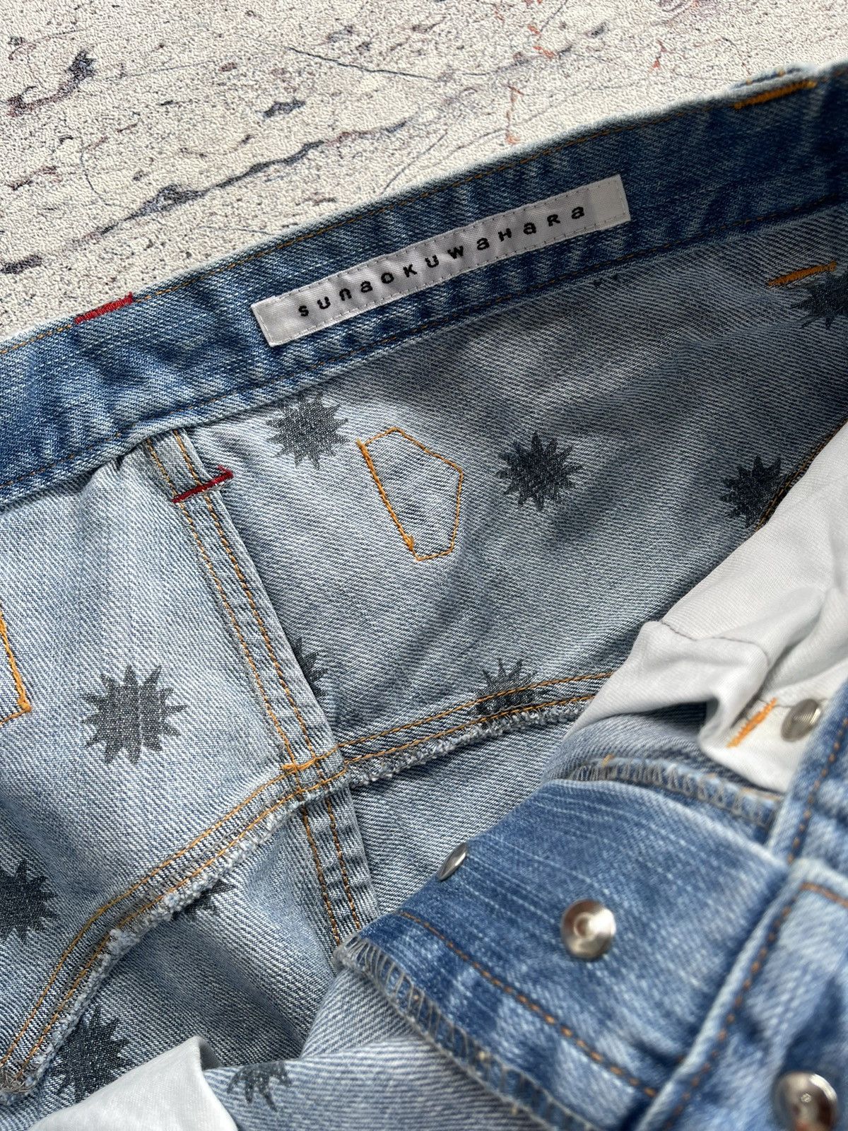 Sunao kuwahara distressed jeans by issey miyake
