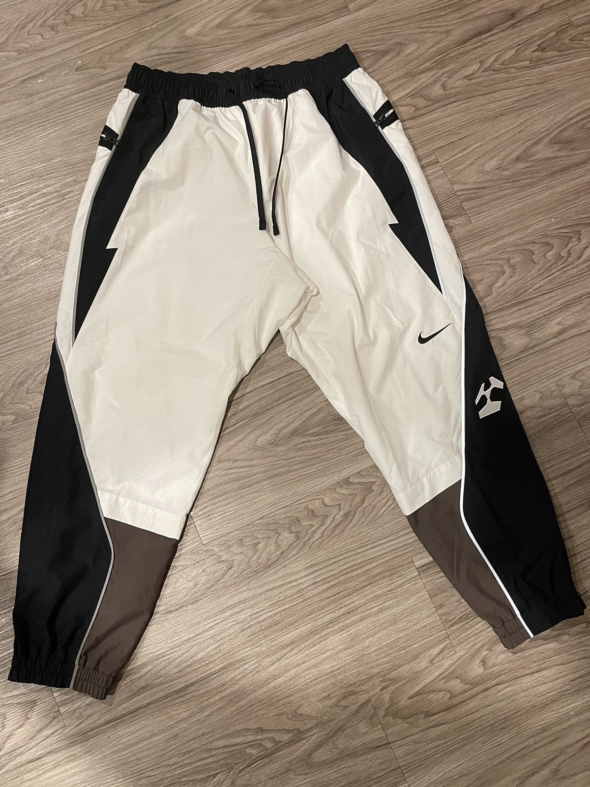 Image of Nike X Acronym Woven Pants in Brown/White, Men's (Size 33)