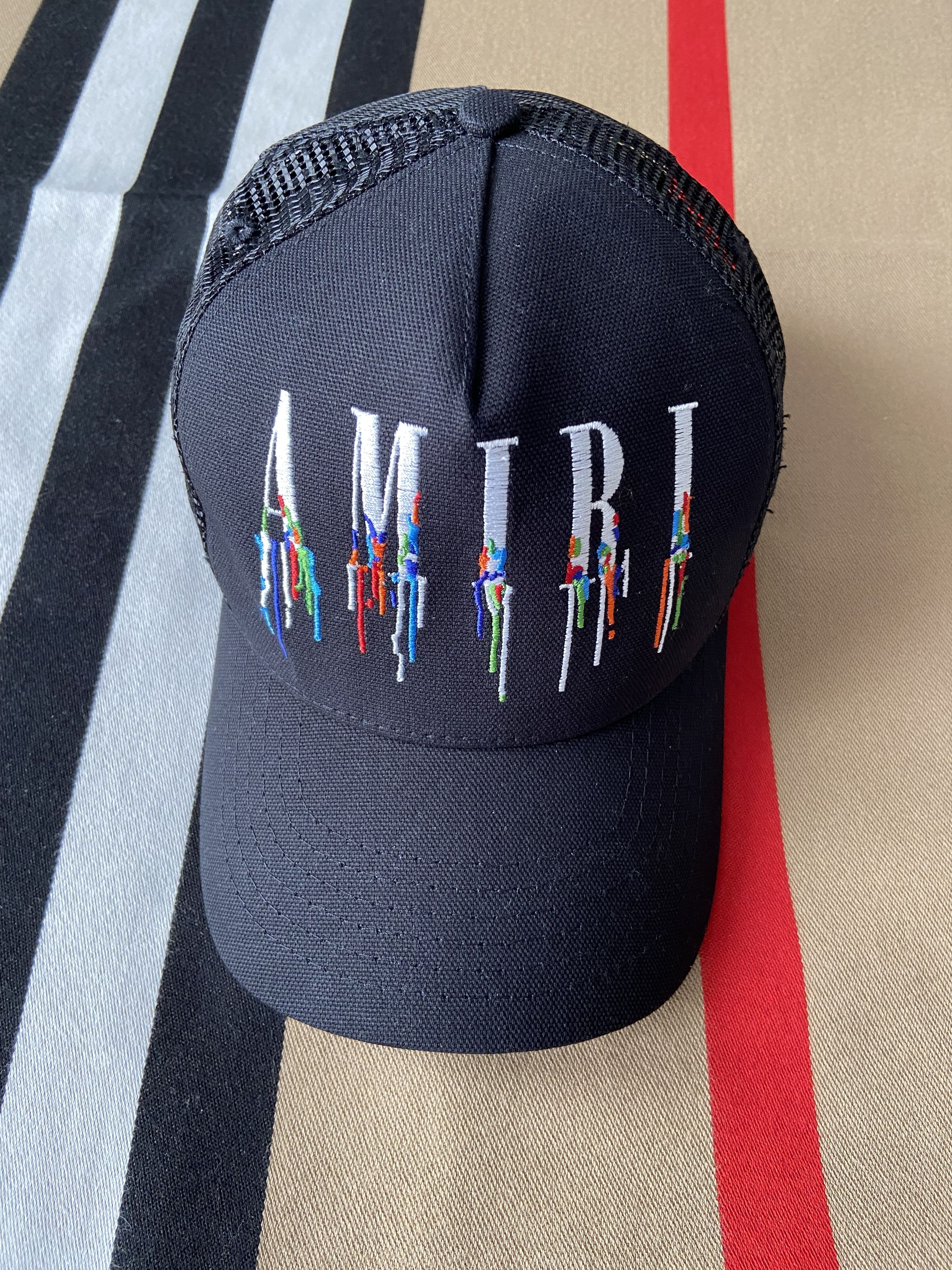 image of New Amiri Paint Drip Logo Trucker Hat in Black, Men's