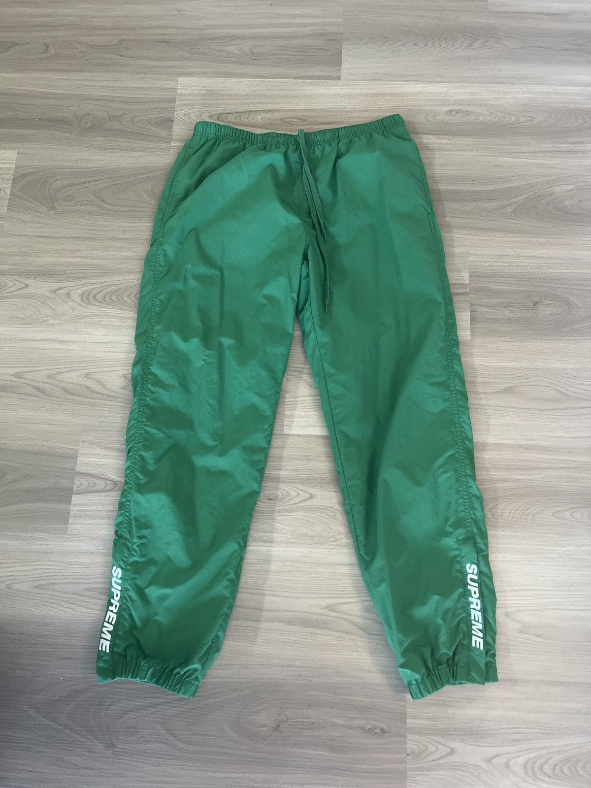 Supreme warm up pants on sale