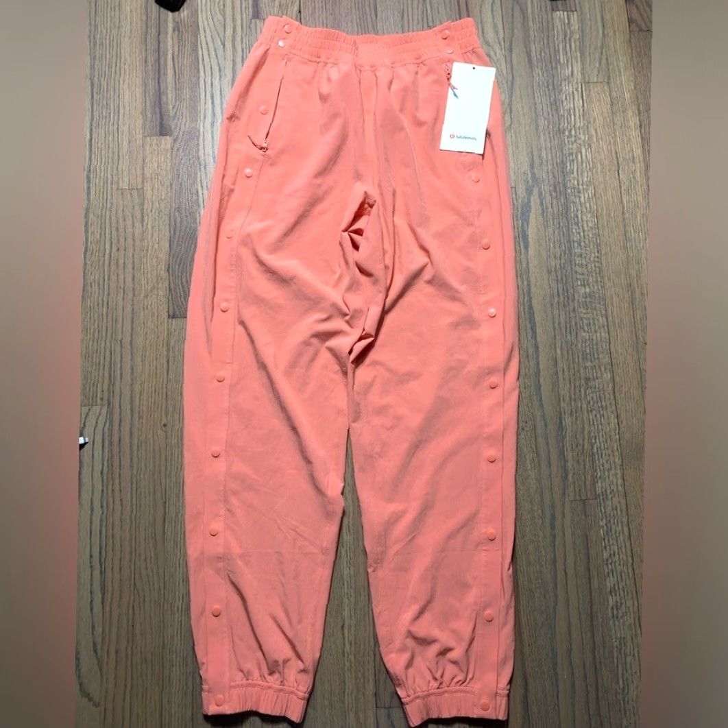 Lululemon NWT Lululemon tearaway mid-ride track pants Coral Kiss Women 4 Regular Orange Track Pants Women Size 27" / US 4 / IT 40 - 2 Thumbnail