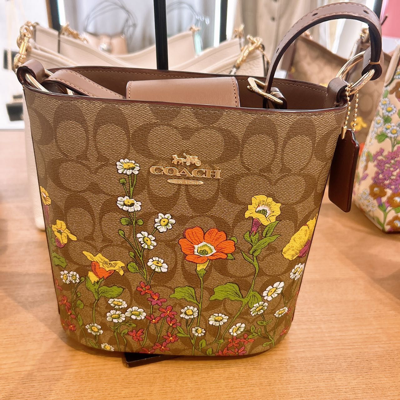 image of Coach Sophie Bucket Bag In Signature Canvas With Floral Cr155 in Gold, Women's