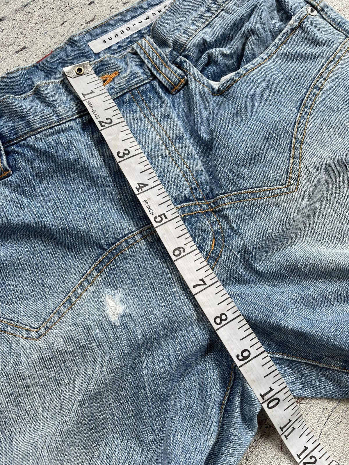 Sunao kuwahara distressed jeans by issey miyake