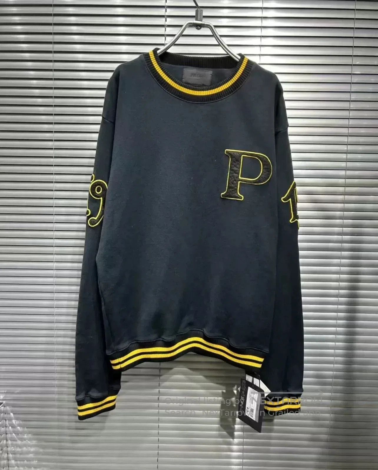prada navy blue embroidered sweatshirt.