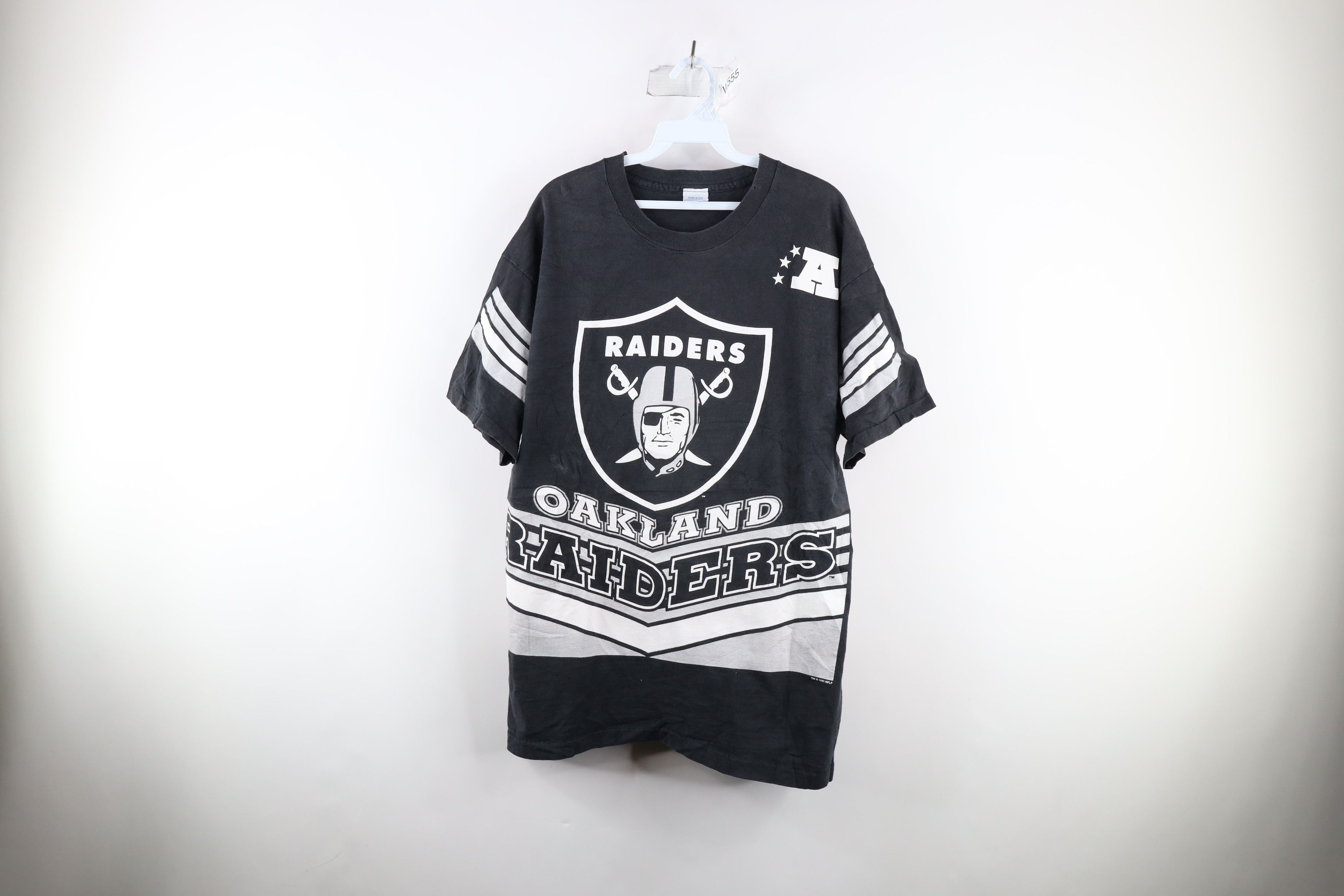 image of Vintage 90's Over Print Oakland Raiders Football T-Shirt Usa in Black, Men's (Size Large)