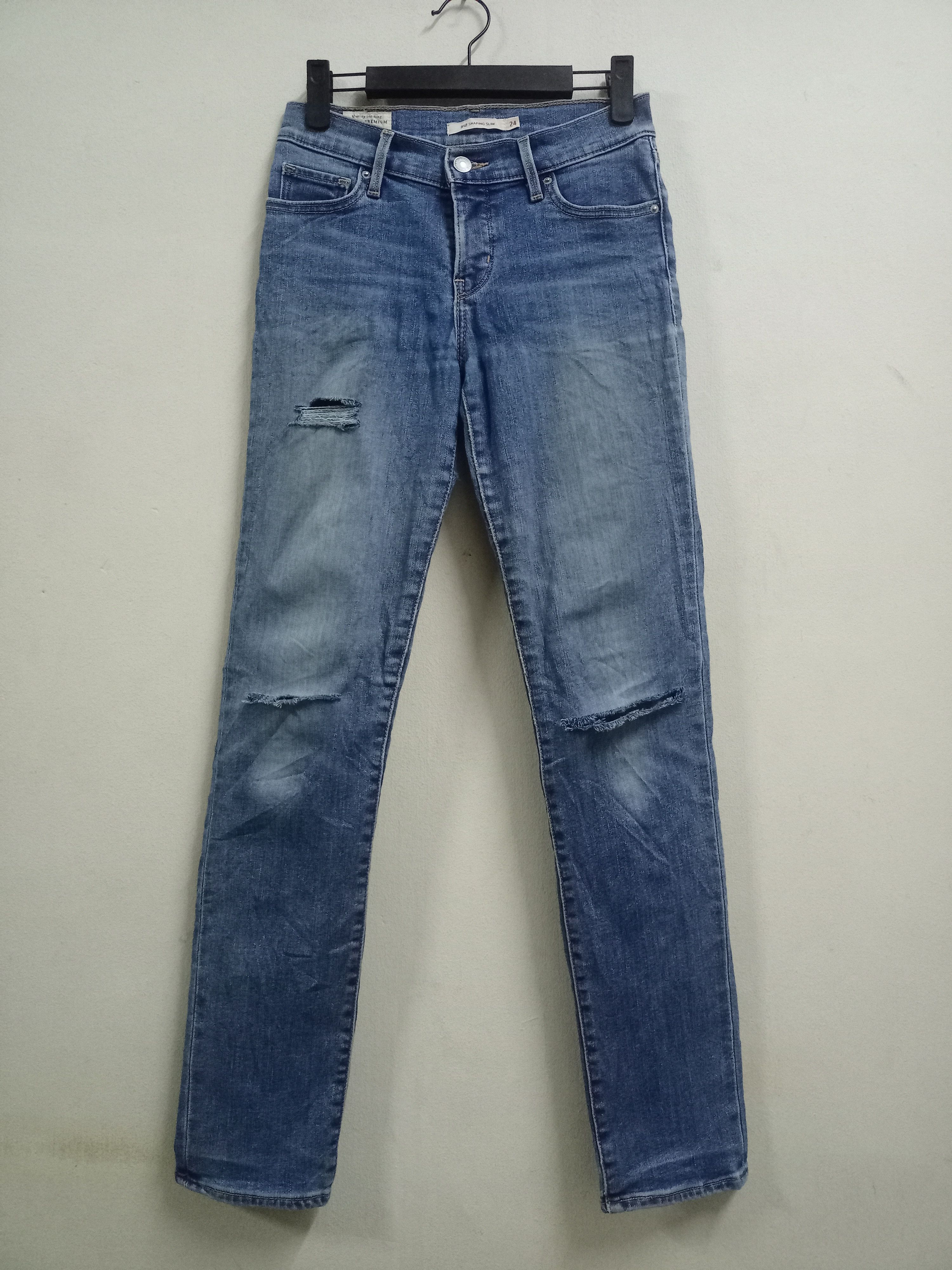 image of Need Gone Vintage Levis 312 Big E Lvc Distressed Jeans in Blue, Women's (Size 26)