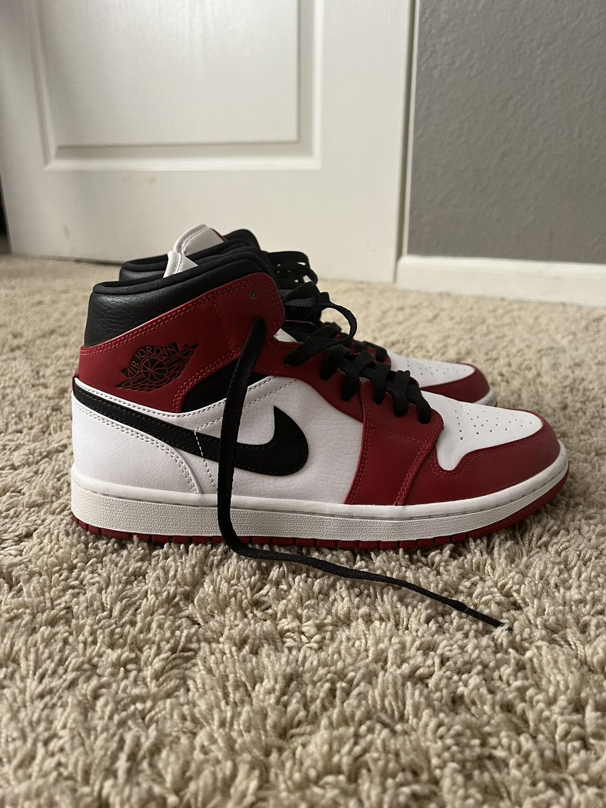image of Jordan Brand 1 Mid Chicago White Toe Shoes in Red, Men's (Size 8)