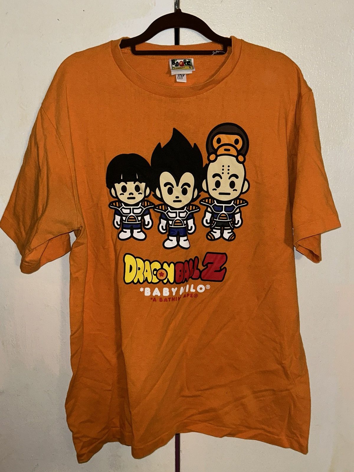 image of Bape X Dragon Ball Z Trio Milo Tee in Orange, Men's (Size Large)