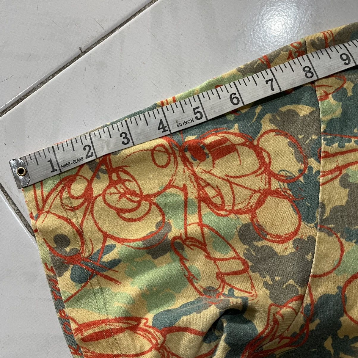 Comme des garcons disney all over print tee