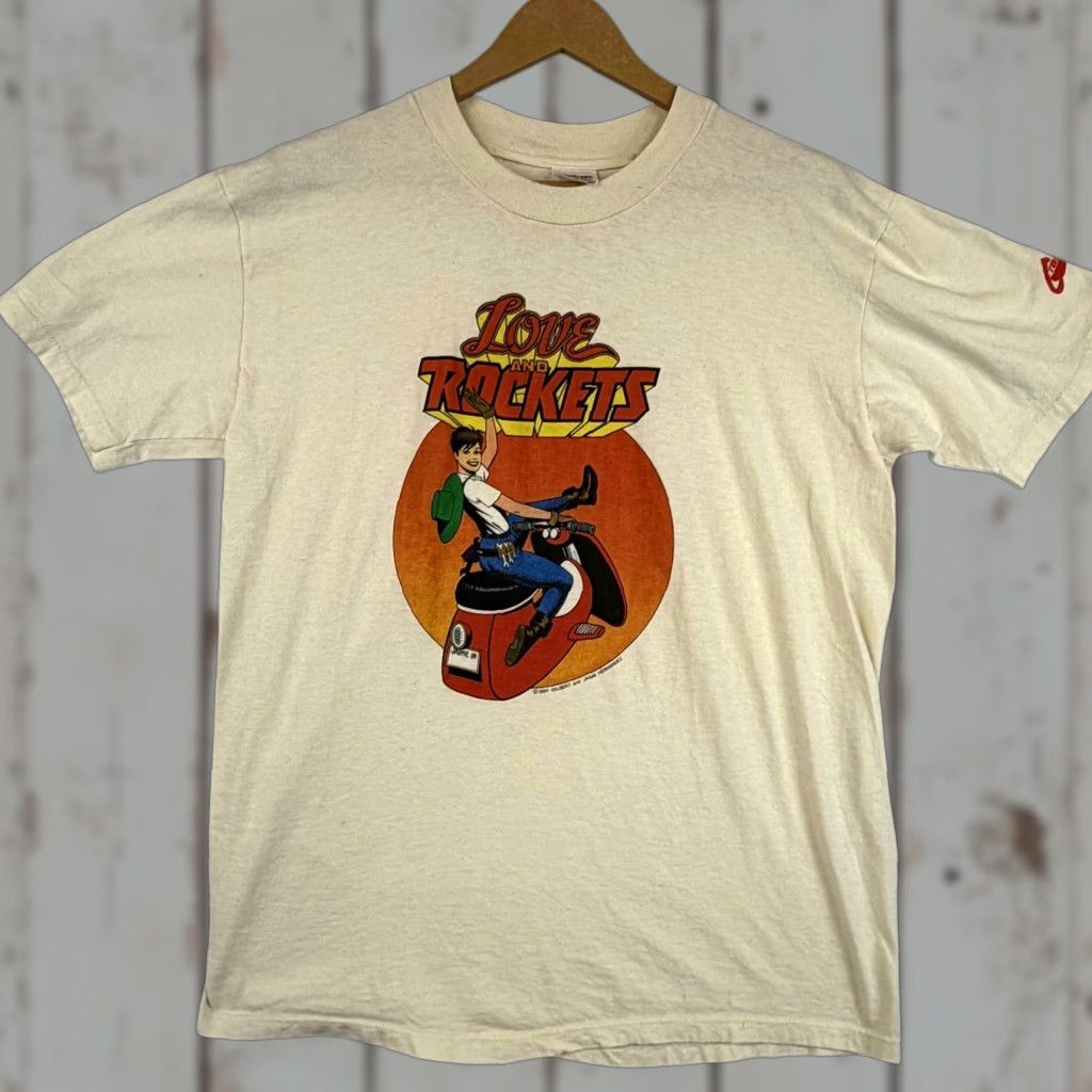 Vintage VINTAGE Love and Rockets Graphitti Tee Mens L Ivory 80s Comics Motorcycle Crew Neck Cotton T-Shirt Short Sleeve Graphic Print Stedman Made in USA Mens Size US L / EU 52-54 / 3 - 1 Thumbnail