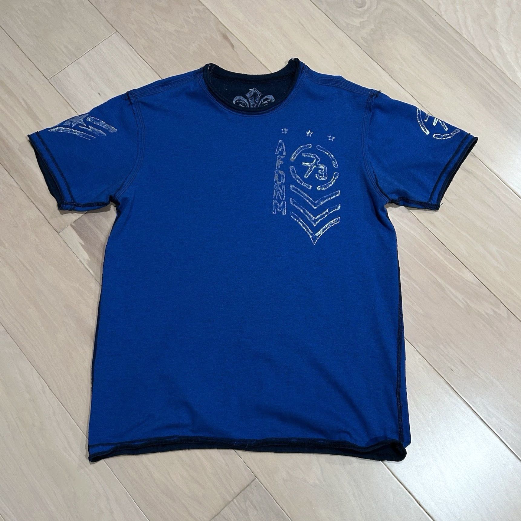 Affliction Affliction T-Shirt Mens Regular Short Sleeve Reversible Blue 100% Cotton Graphic Print Logo Skull Biker Streetwear 30 length 22-1/2 pit to pit Size US L / EU 52-54 / 3 - 4 Thumbnail