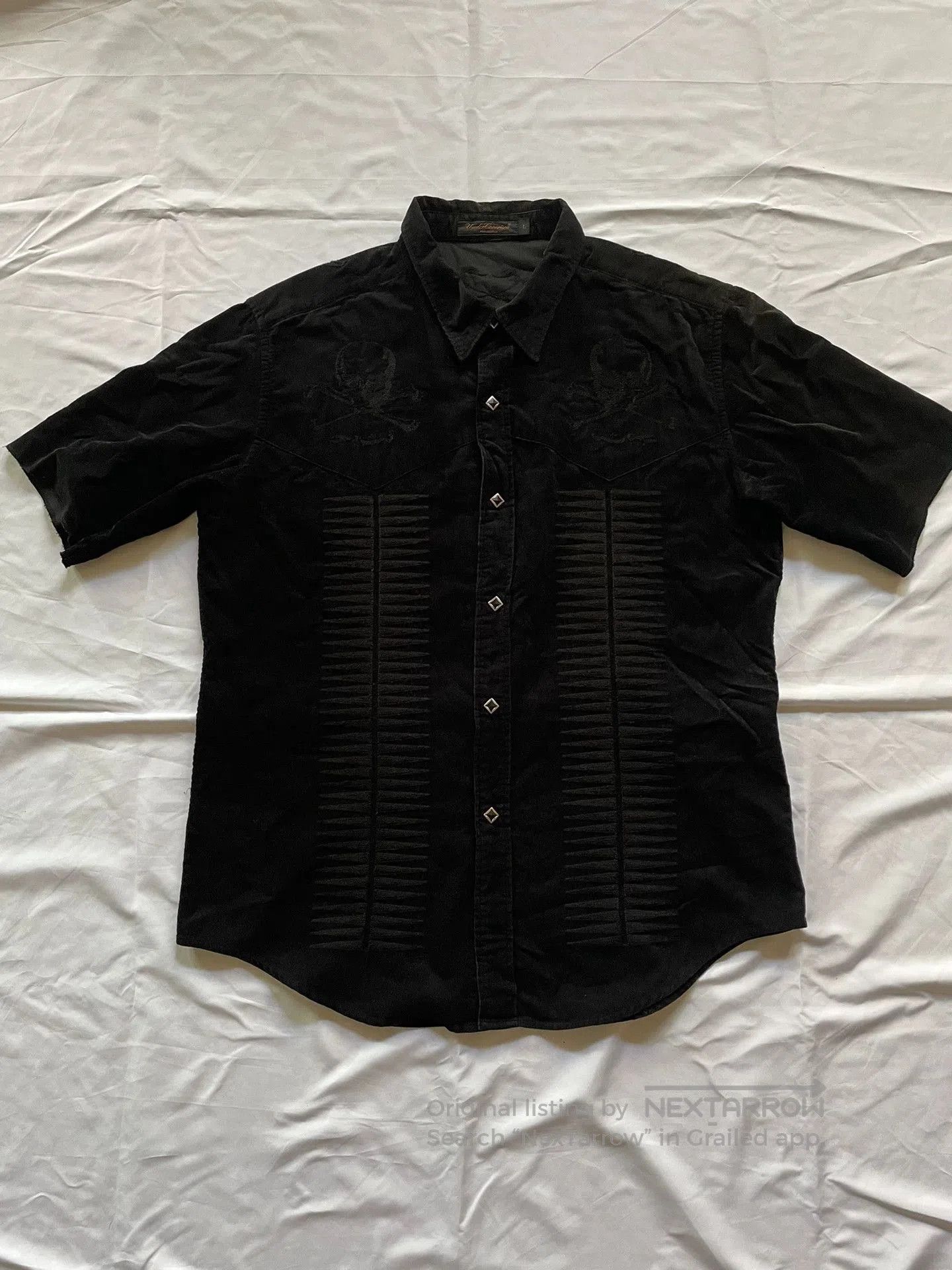 black short sleeve shirt with embroidery.