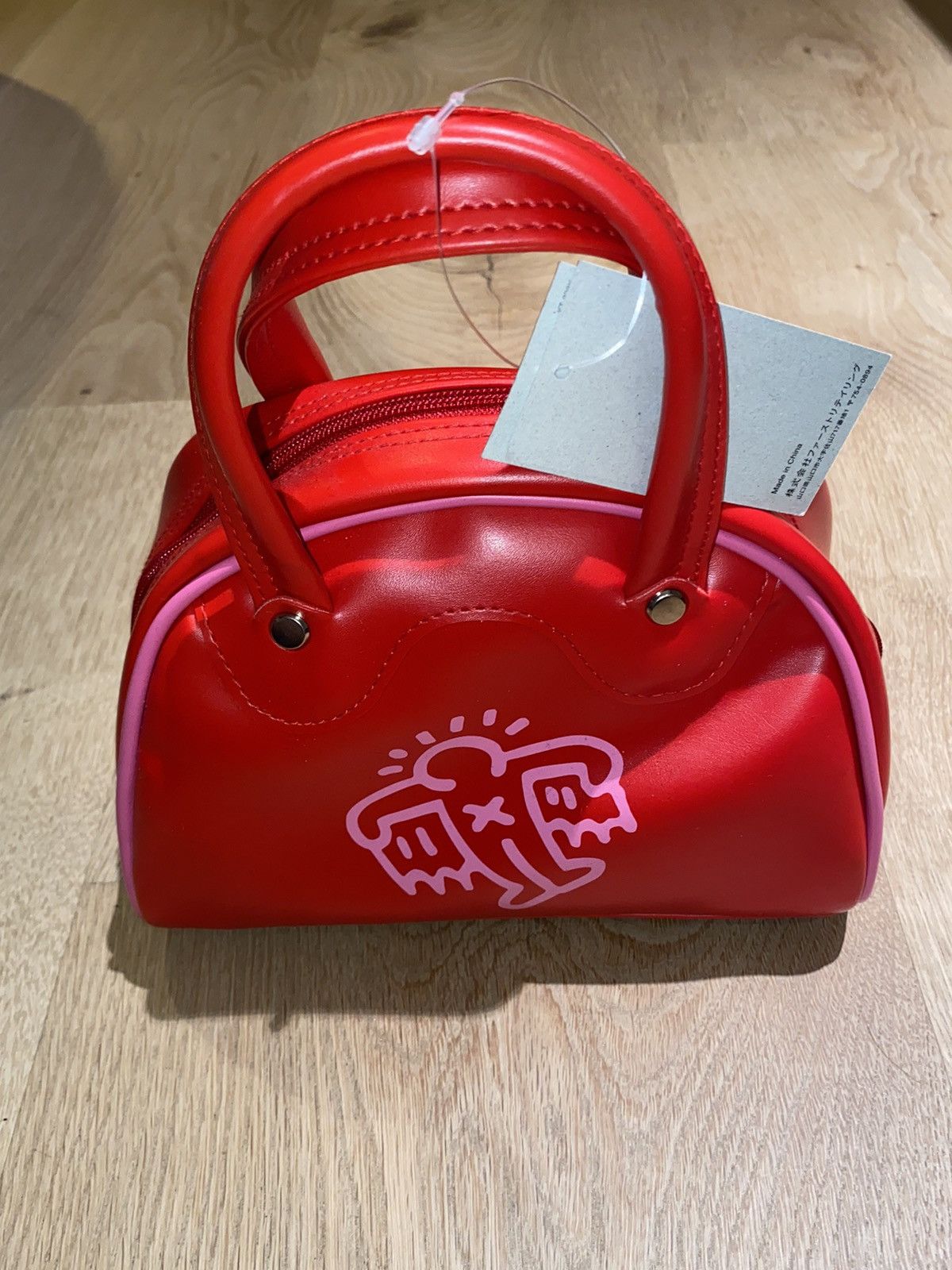 image of Keith Haring Flying Wings Leather Mini Handbag in Red, Women's